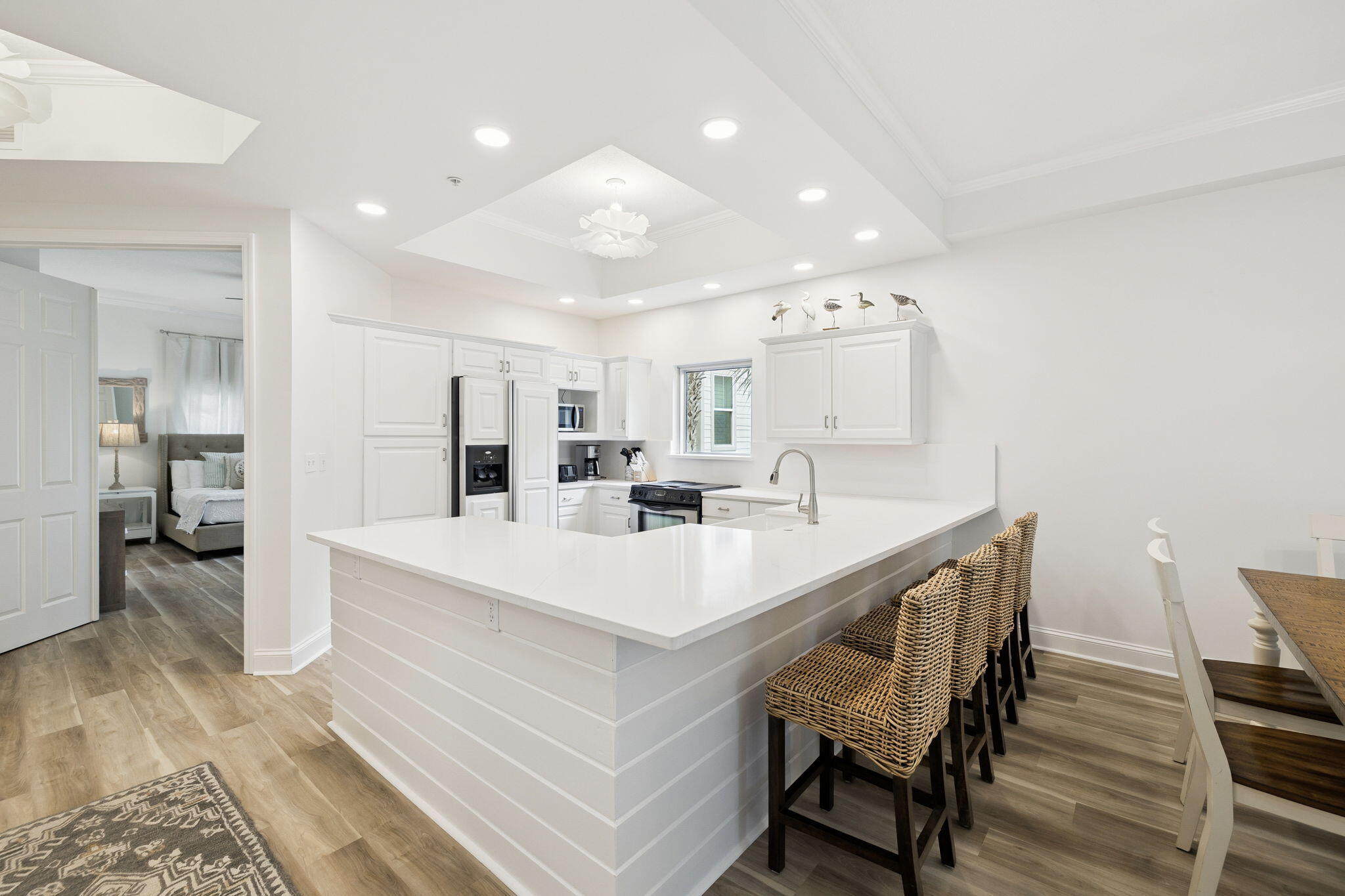 9961 East County Highway 30A, Unit 201 Inlet Beach, FL 32461 - Photo 4 of 35 a large white kitchen with a table and chairs