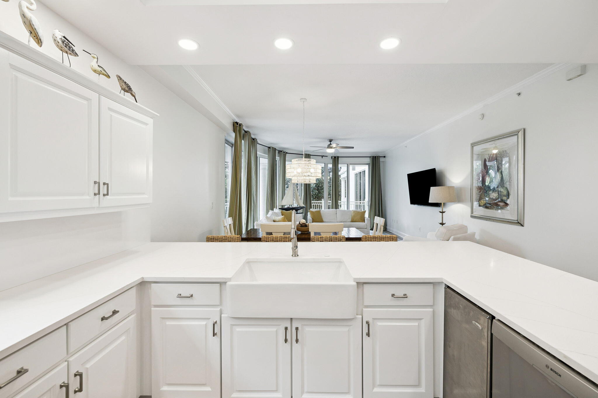 9961 East County Highway 30A, Unit 201 Inlet Beach, FL 32461 - Photo 5 of 35 a view of a kitchen with kitchen island a sink stainless steel appliances and cabinets