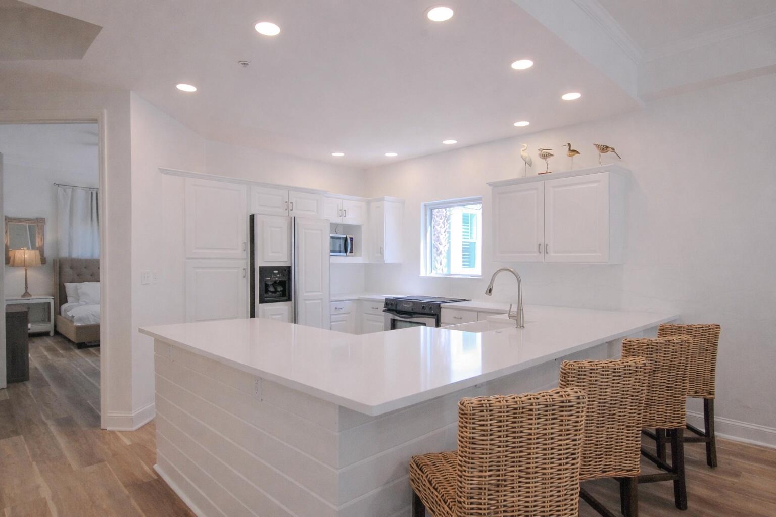9961 East County Highway 30A, Unit 201 Inlet Beach, FL 32461 - Photo 7 of 19 a living room with stainless steel appliances furniture a rug kitchen view and a table