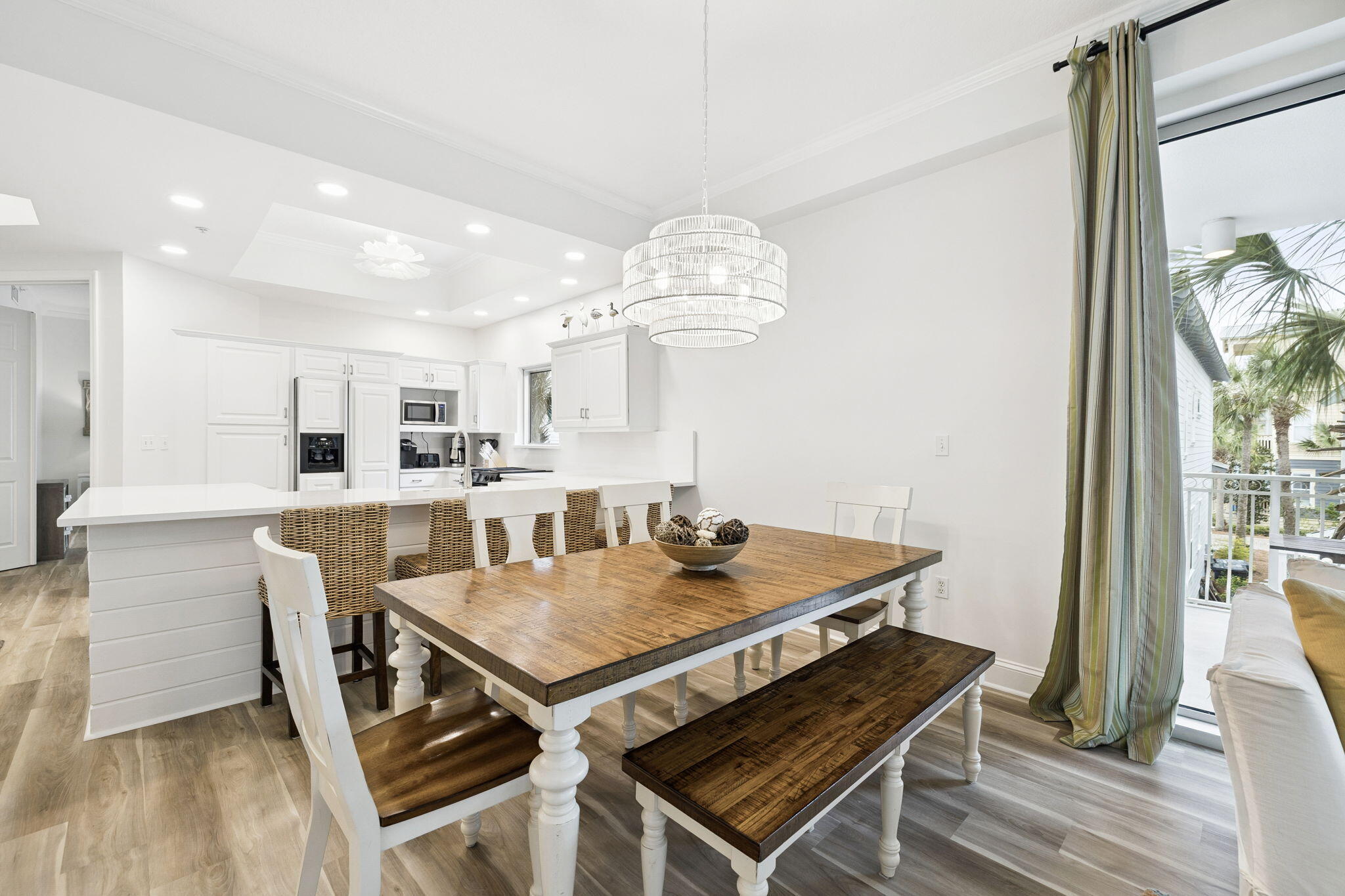 9961 East County Highway 30A, Unit 201 Inlet Beach, FL 32461 - Photo 8 of 35 a view of a dining room with furniture and wooden floor