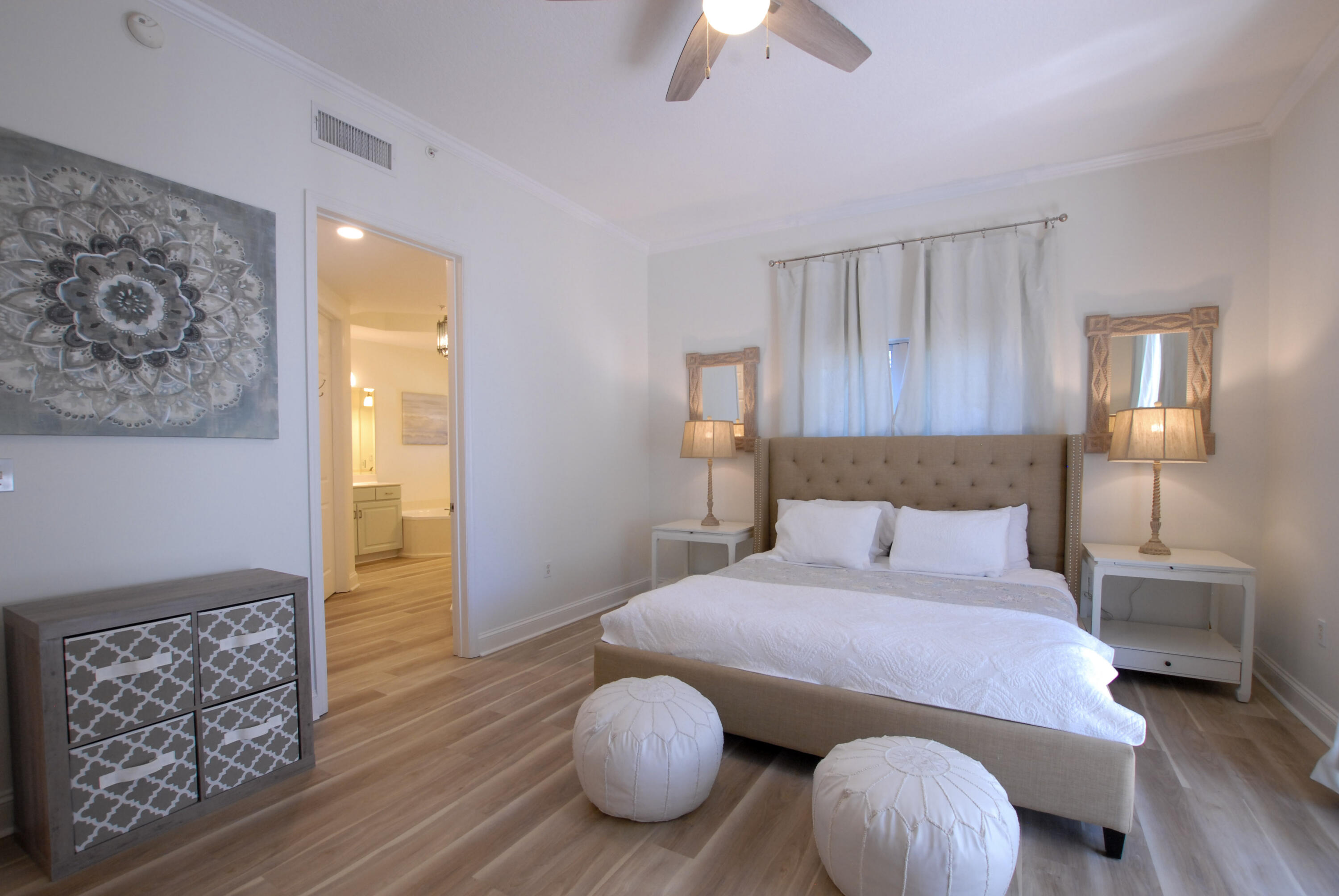 9961 East County Highway 30A, Unit 201 Inlet Beach, FL 32461 - Photo 9 of 19 a bedroom with a bed and wooden floor