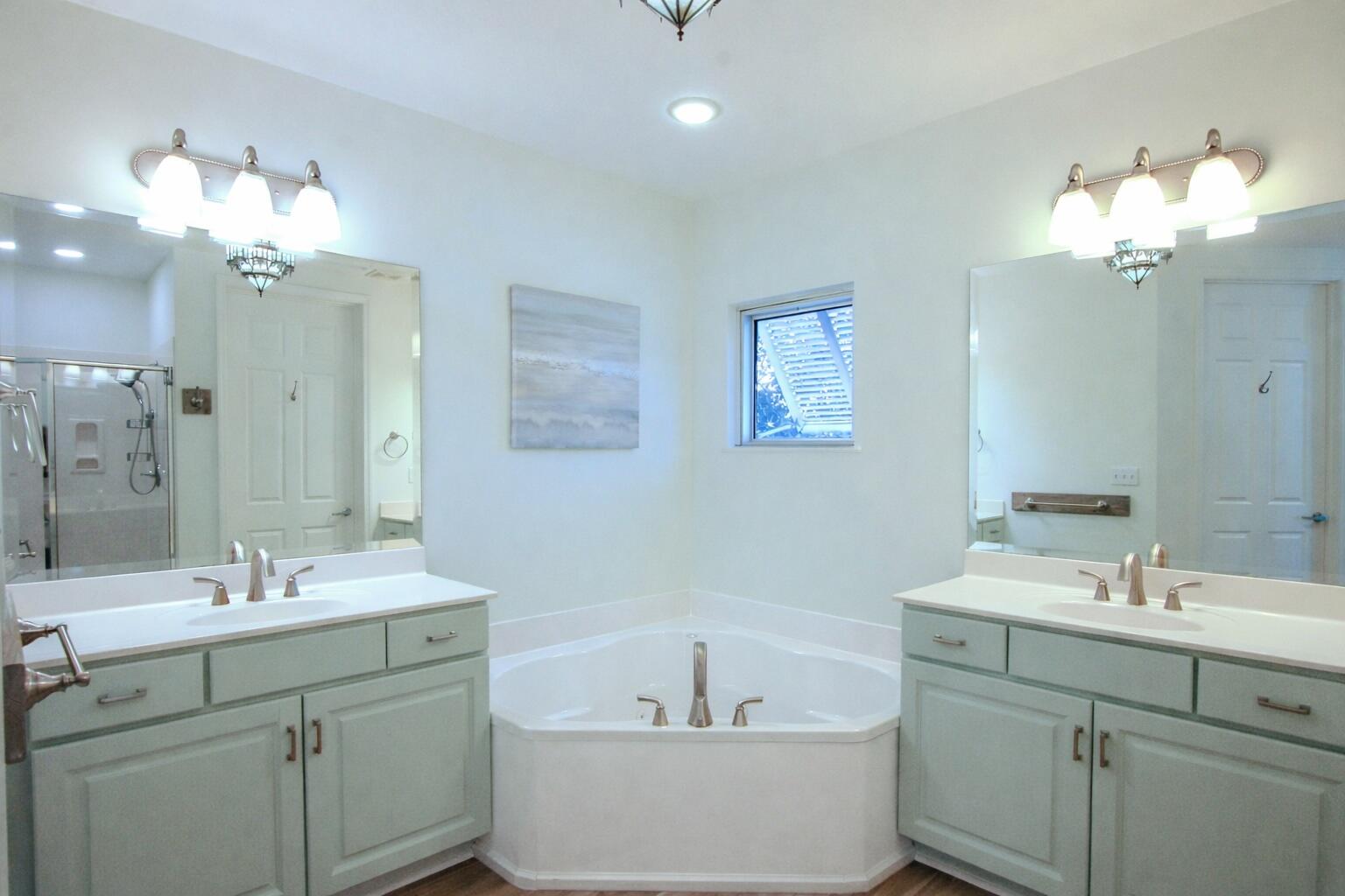 9961 East County Highway 30A, Unit 201 Inlet Beach, FL 32461 - Photo 10 of 19 a bathroom with a double vanity sink mirror and bathtub