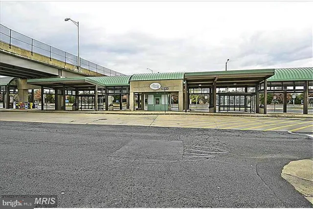 a front view of building with small garden