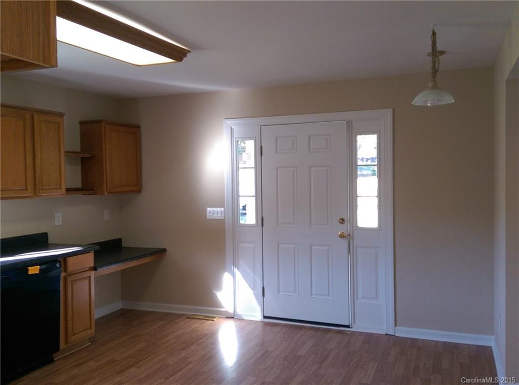 162 Sardis Road Mooresville, NC 28115 - Photo 5 of 15 a view of a kitchen with wooden floor and cabinets
