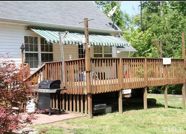 125 Oak Road Butner, NC 27509 - Photo 4 of 8 Entertain your friends and family on this beautiful back deck, for just relax and enjoy the serenity of the private back yard.