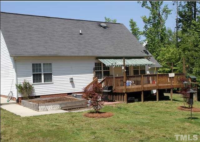 125 Oak Road Butner, NC 27509 - Photo 5 of 8 Exterior back of home and deck area.