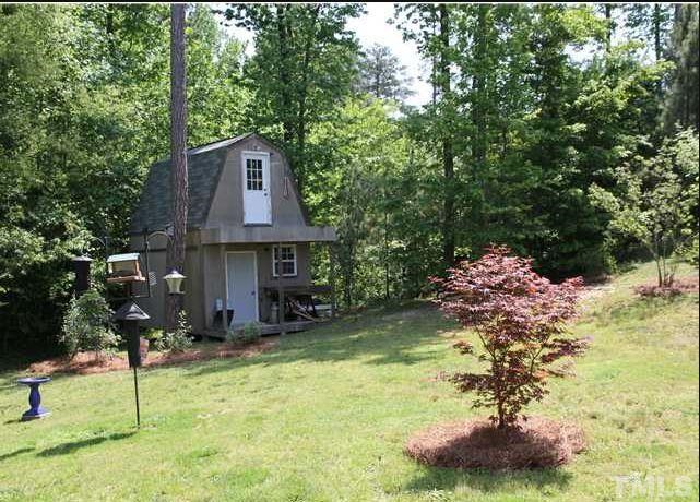 125 Oak Road Butner, NC 27509 - Photo 6 of 8 View 2 of lovely landscaped back yard and storage shed