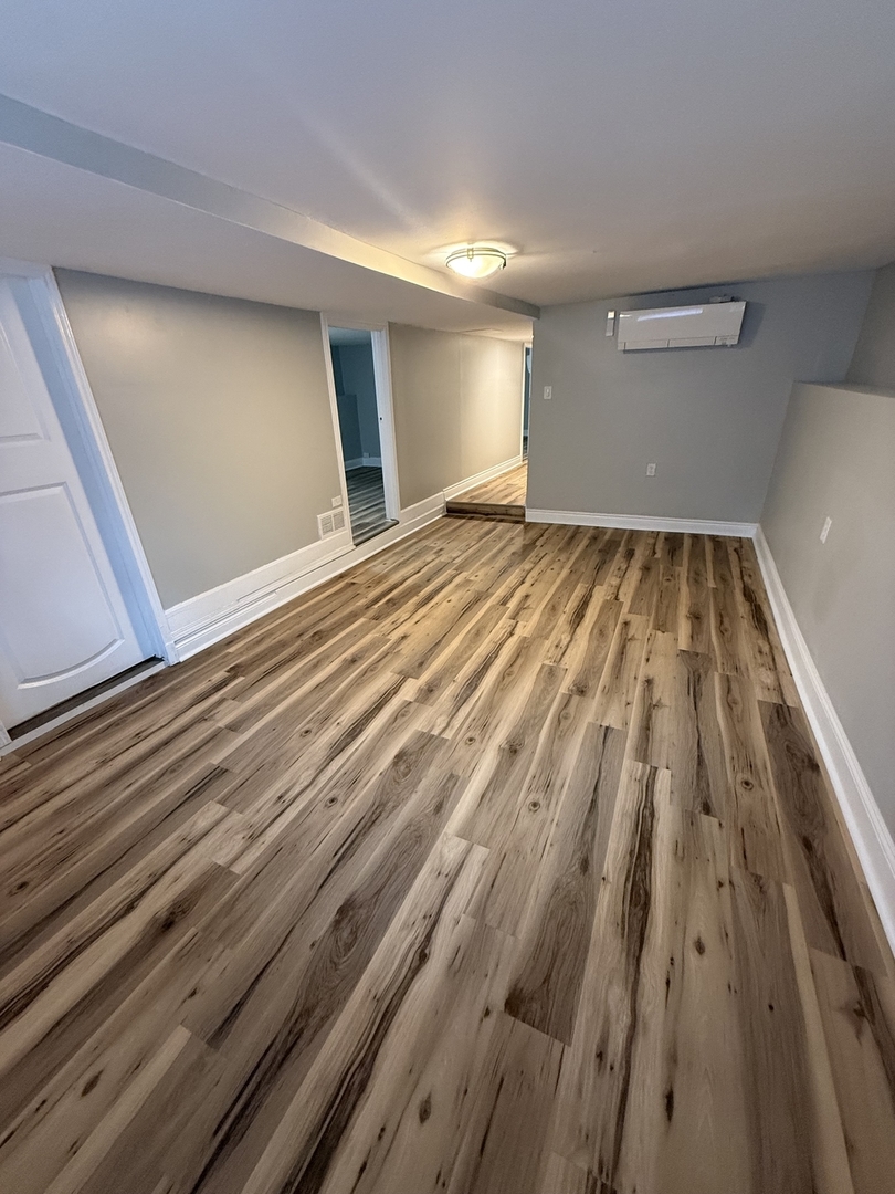 Undisclosed Address Chicago, IL 60647 - Photo 3 of 13 a view of wooden floor