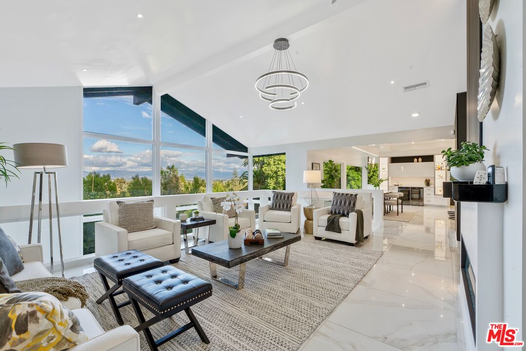 4854 Brewster Drive Tarzana, CA 91356 - Photo 15 of 60 a living room with furniture and a large window