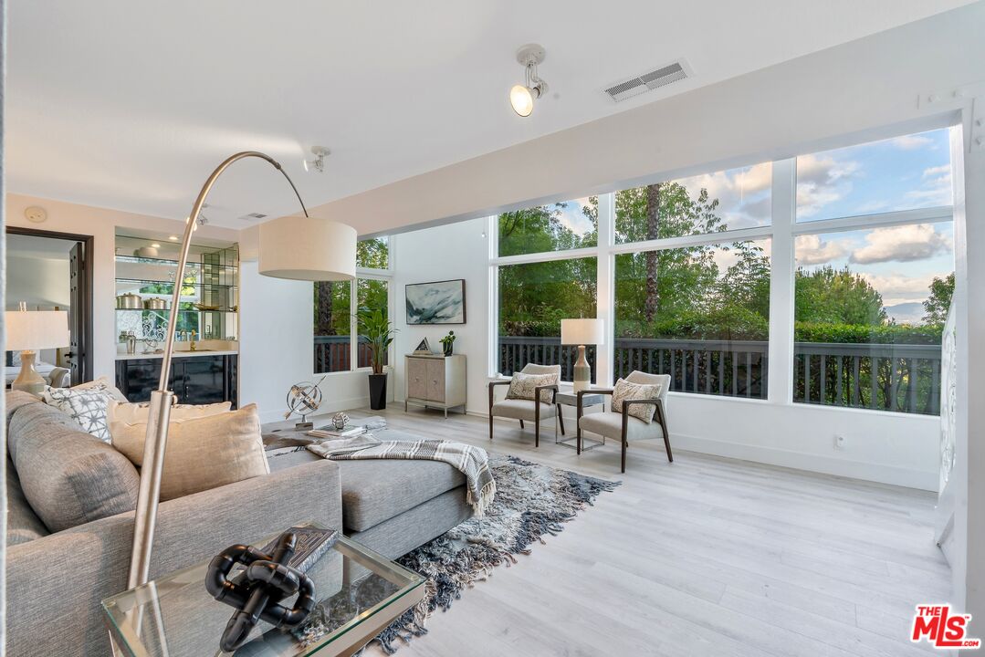 4854 Brewster Drive Tarzana, CA 91356 - Photo 35 of 60 a living room with furniture and a large window