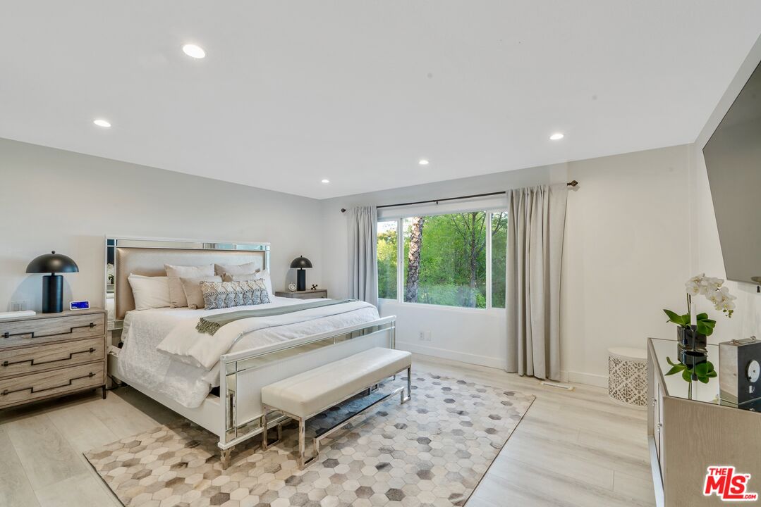 4854 Brewster Drive Tarzana, CA 91356 - Photo 36 of 60 a bed room with a bed and a window