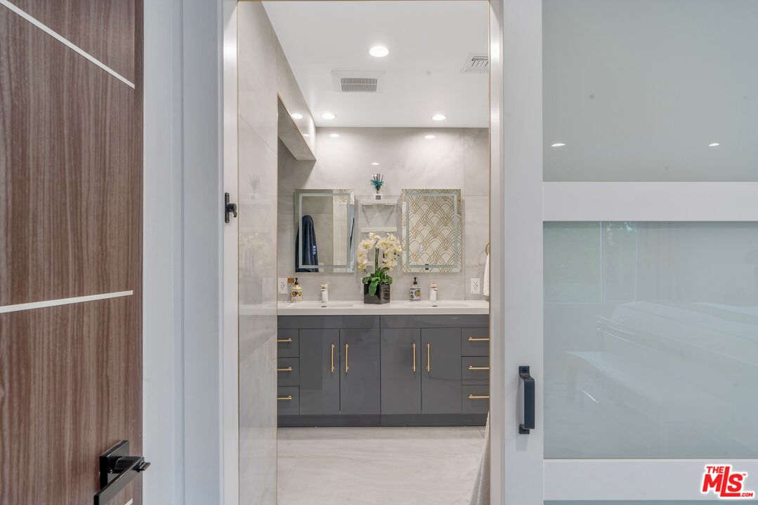 4854 Brewster Drive Tarzana, CA 91356 - Photo 38 of 60 a view of kitchen with granite countertop cabinets and sink