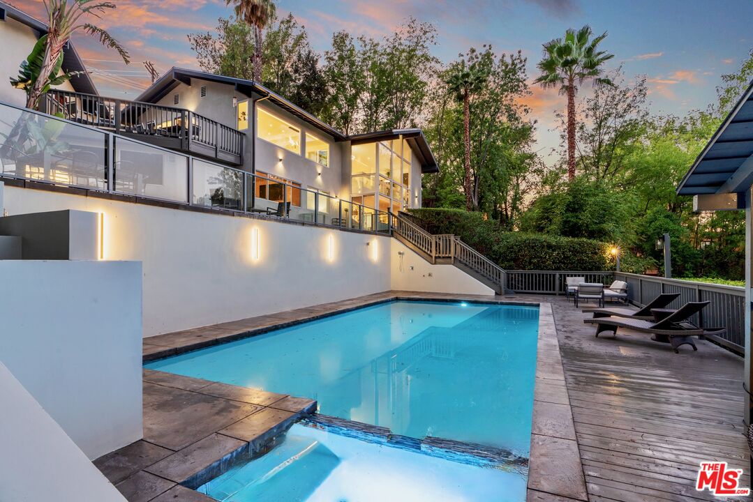 4854 Brewster Drive Tarzana, CA 91356 - Photo 55 of 60 a view of a swimming pool with sitting area