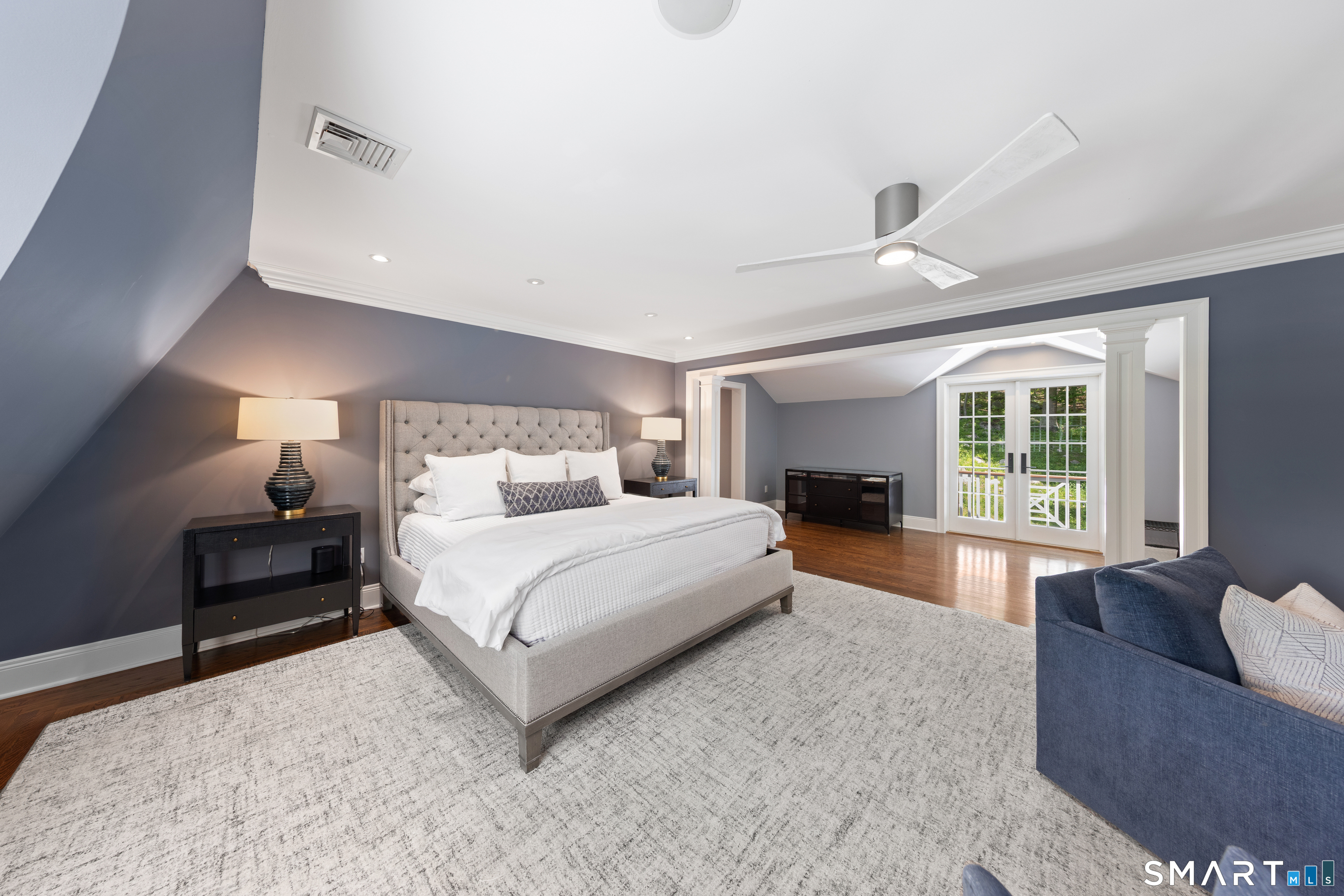 99 Hickok Road New Canaan, CT 06840 - Photo 17 of 39 a spacious bedroom with a large bed and a couch
