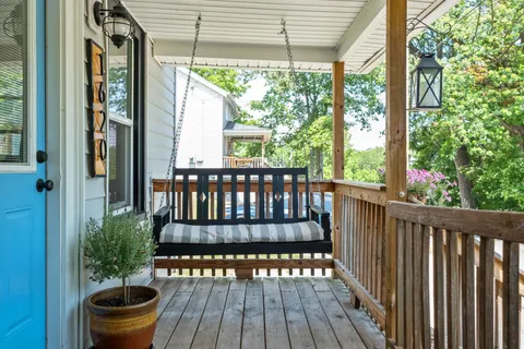 a view of a balcony with wooden floor
