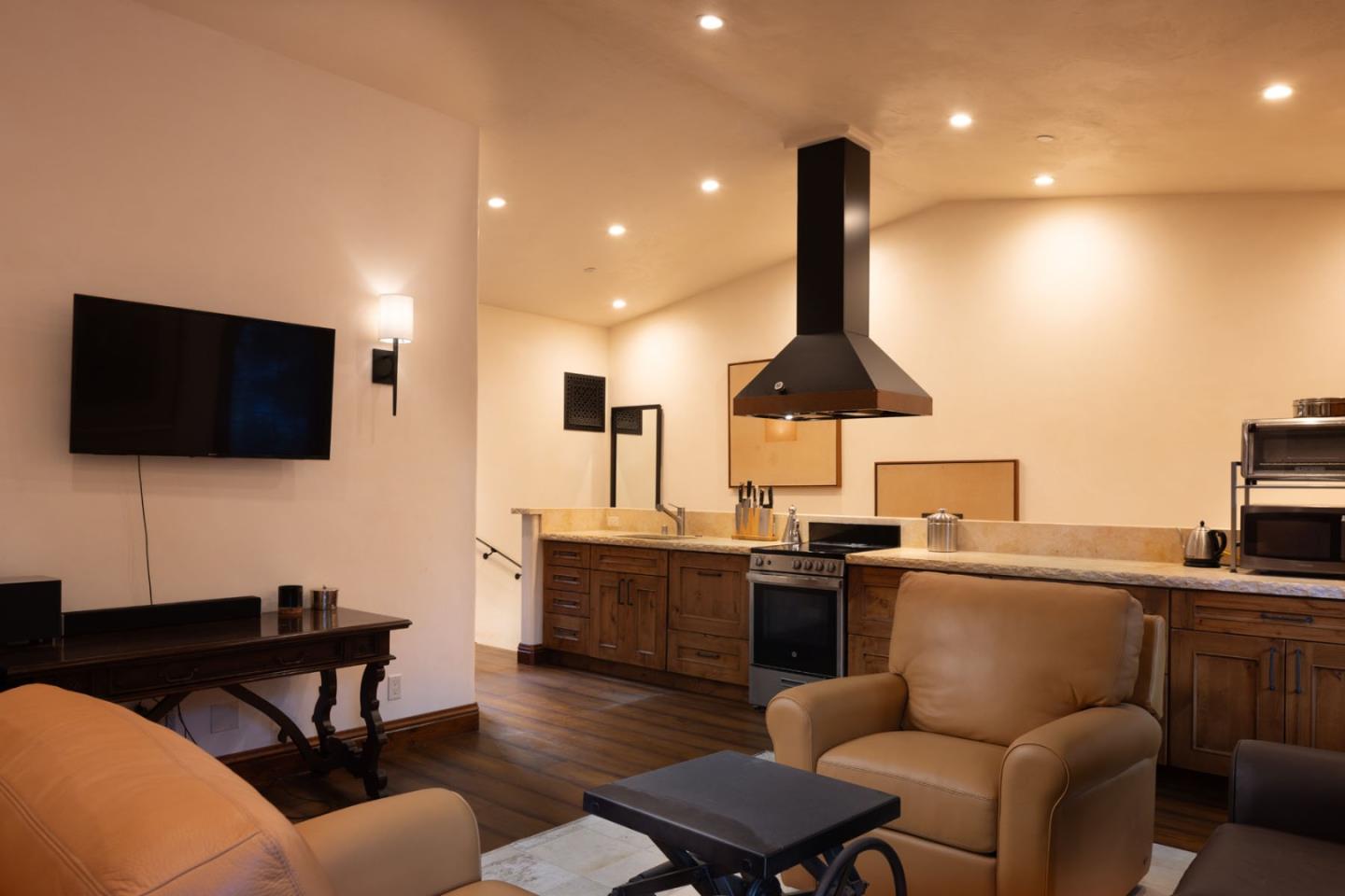 4 Rumsen Trace Carmel, CA 93923 - Photo 14 of 21 a living room with furniture and a flat screen tv