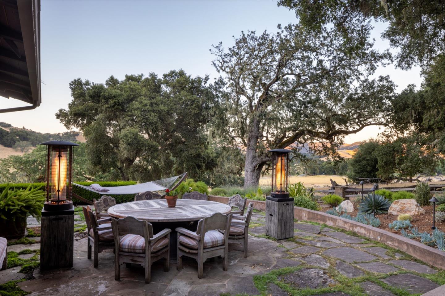 4 Rumsen Trace Carmel, CA 93923 - Photo 15 of 21 a backyard of a house with barbeque oven table and chairs