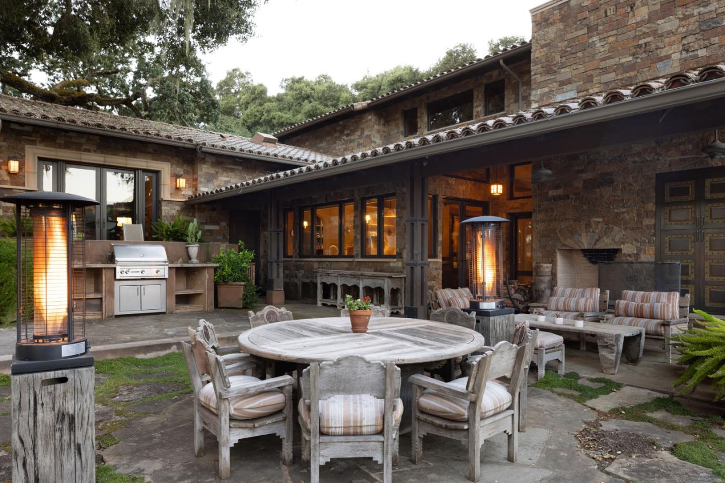 4 Rumsen Trace Carmel, CA 93923 - Photo 16 of 21 a view of a patio with table and chairs and potted plants