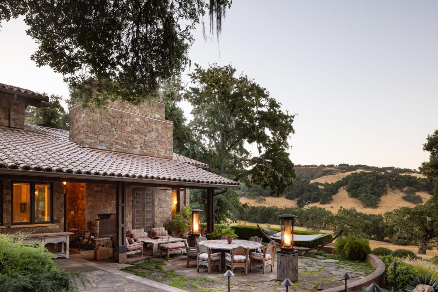4 Rumsen Trace Carmel, CA 93923 - Photo 19 of 21 a view of a patio with table and chairs under an umbrella