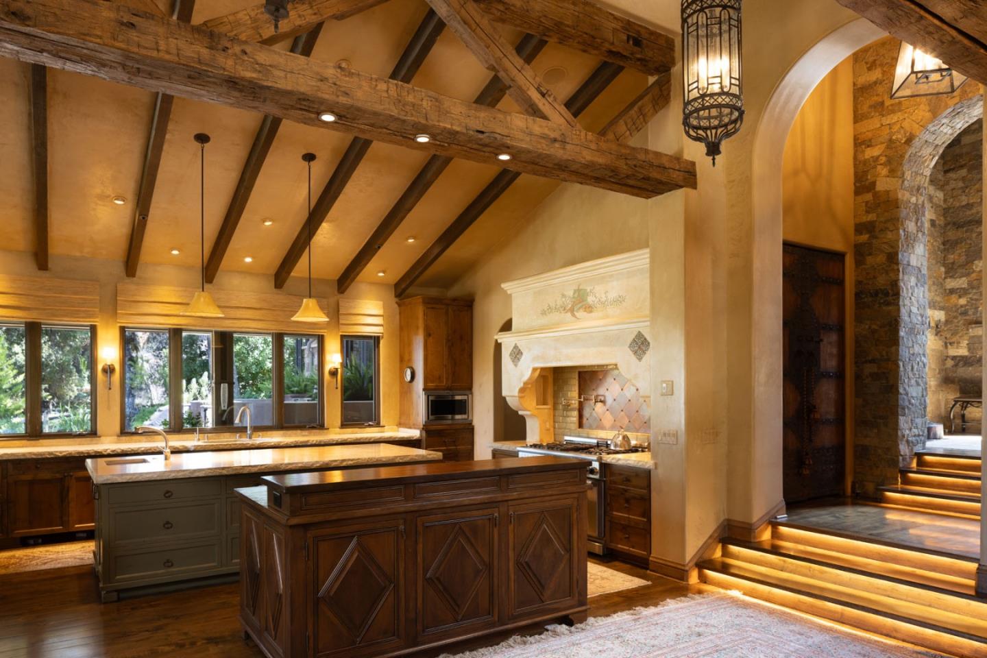 4 Rumsen Trace Carmel, CA 93923 - Photo 6 of 21 a large kitchen with stainless steel appliances wooden cabinets a sink and a large window
