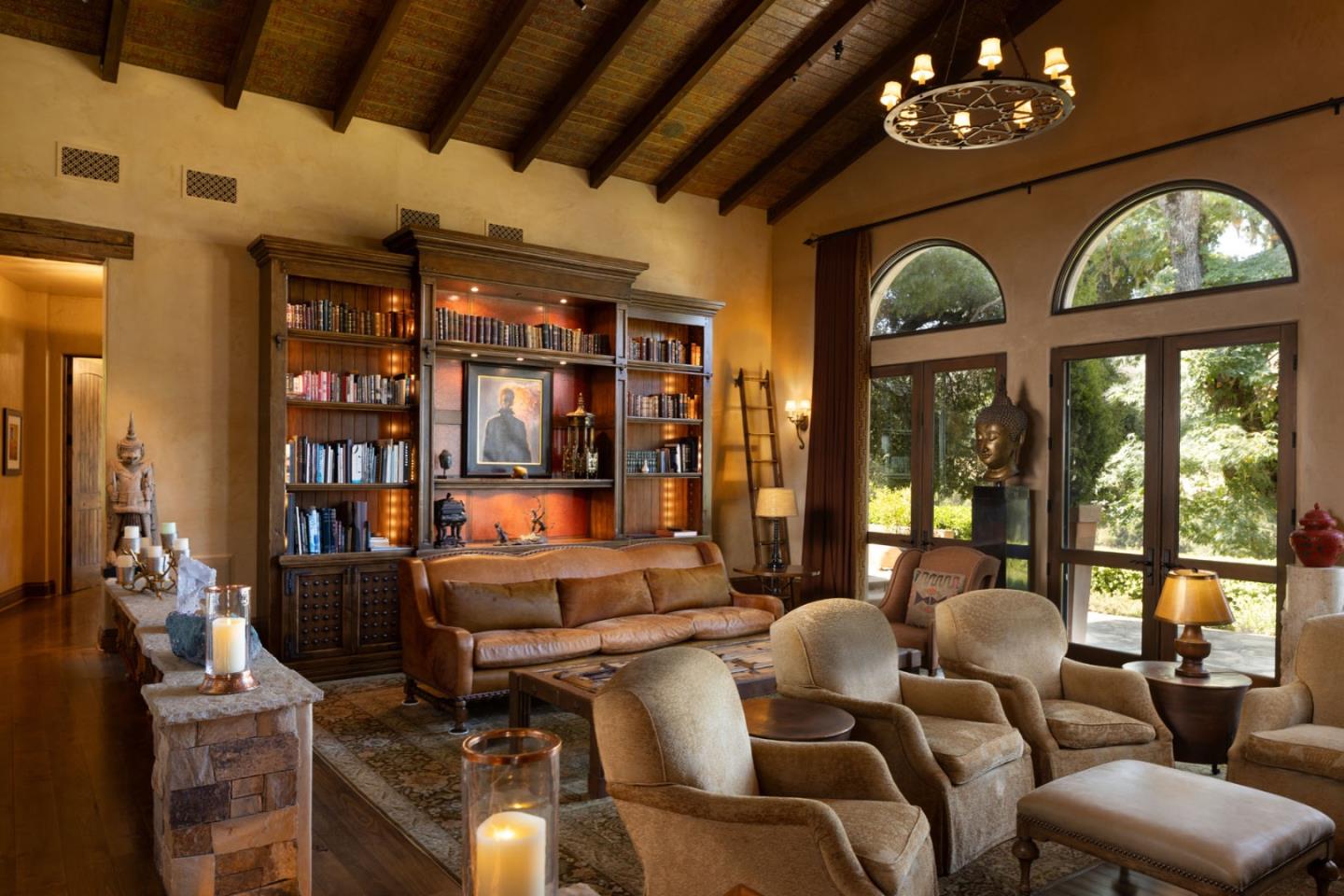 4 Rumsen Trace Carmel, CA 93923 - Photo 8 of 21 a living room with furniture a chandelier and a large window