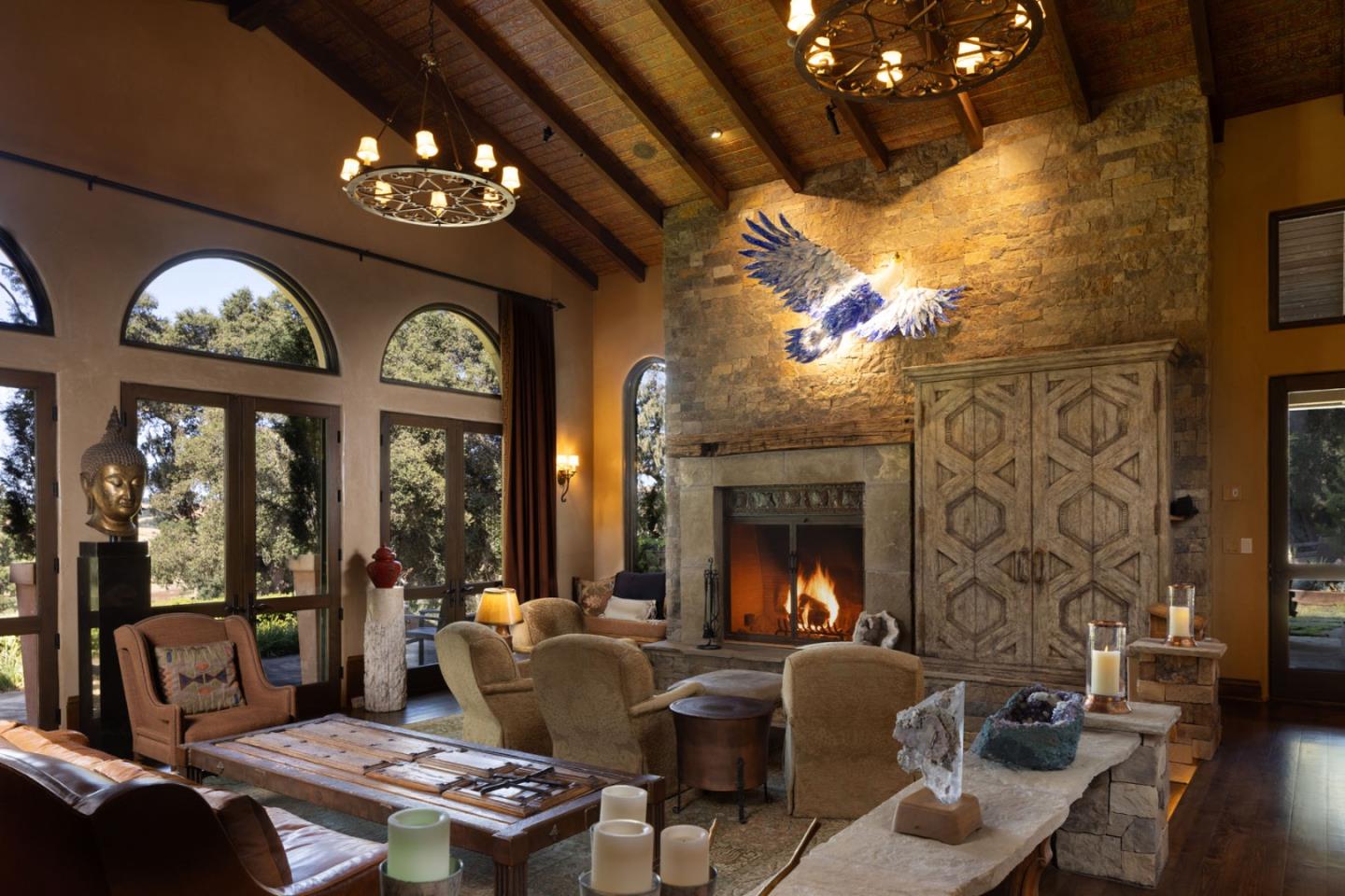 4 Rumsen Trace Carmel, CA 93923 - Photo 9 of 21 a living room with furniture a chandelier and a fireplace