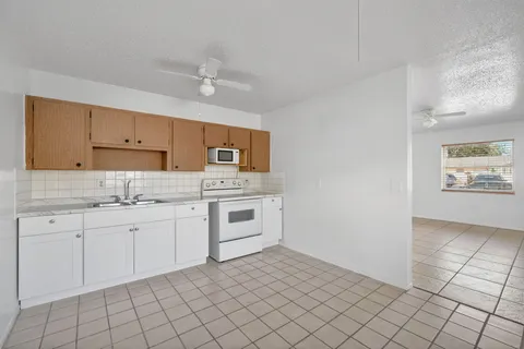 a close view of a sink and dishwasher in a kitchen