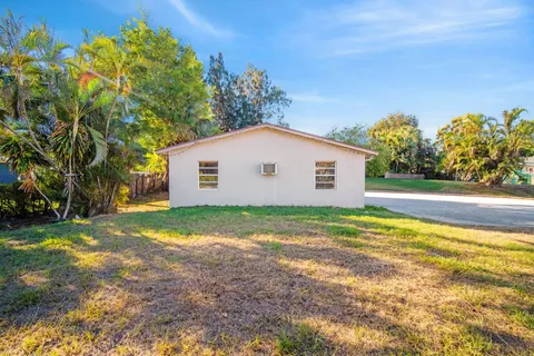 a view of a swimming pool with a yard