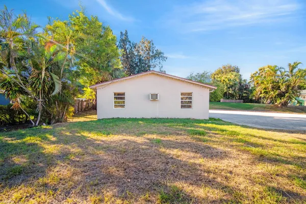 a view of a swimming pool with a yard