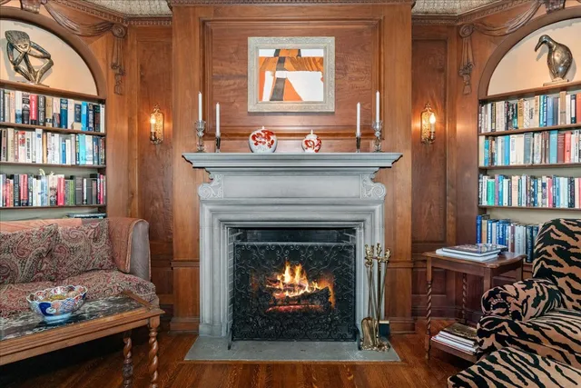 a kitchen with stainless steel appliances granite countertop a refrigerator and a table chair