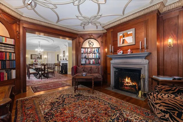 a kitchen with stainless steel appliances granite countertop a sink dishwasher stove and cabinets with wooden floor