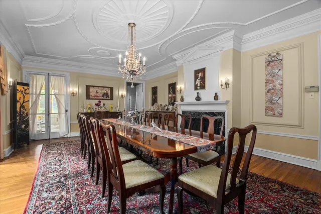 a view of an entryway wooden floor and a chandelier