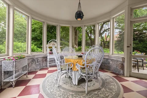 a bedroom with a large bed and a fireplace