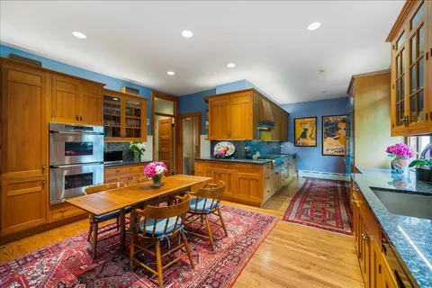 a view of a yard with large trees