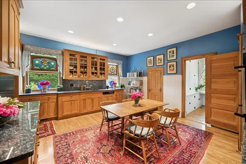a view of a dining room with furniture window and wooden floor