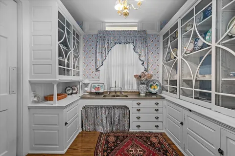 a bathroom with a sink a toilet and bathtub