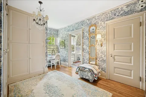 a front view of a house with yard and green space