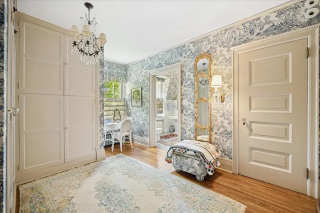 a front view of a house with yard and green space