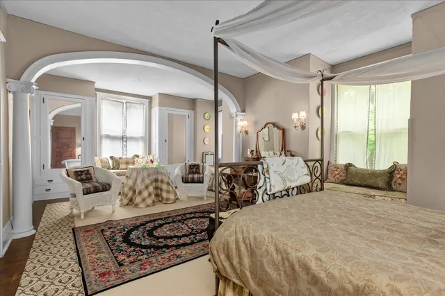 a living room with furniture rug and window