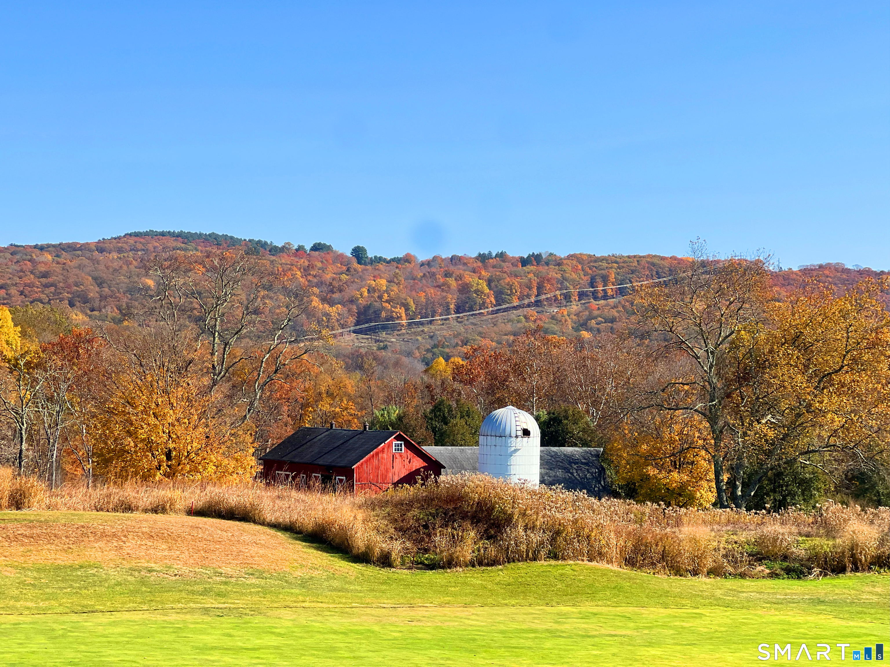 40 Long River Road Sherman, CT 06784 - Photo 20 of 24 a view of a lake with a mountain in the background