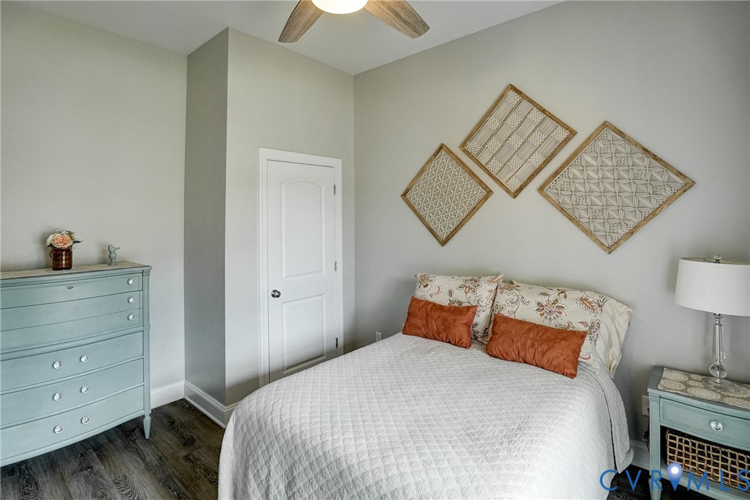 4669 Woburn Road Providence Forge, VA 23140 - Photo 22 of 78 a bedroom with a bed and a lamp on dresser