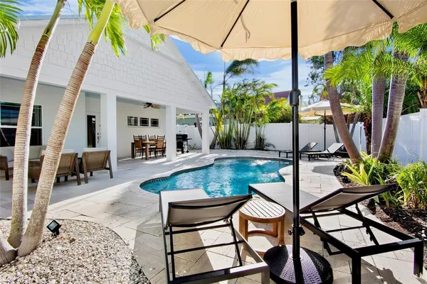 a view of an outdoor sitting area with swimming pool