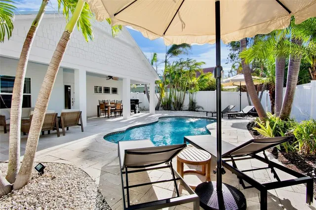 a view of an outdoor sitting area with swimming pool