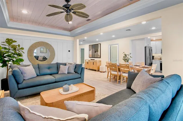 a living room with furniture and a clock