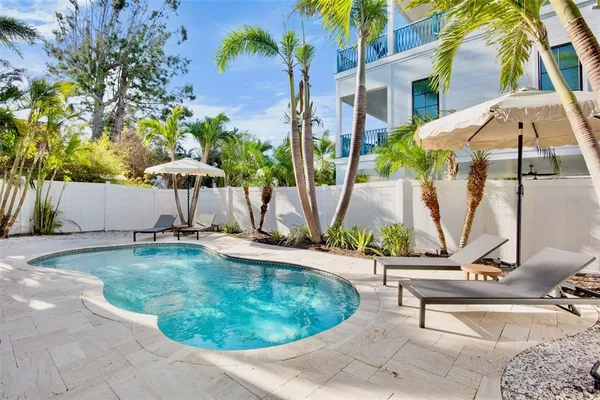 a view of swimming pool with a yard and seating area