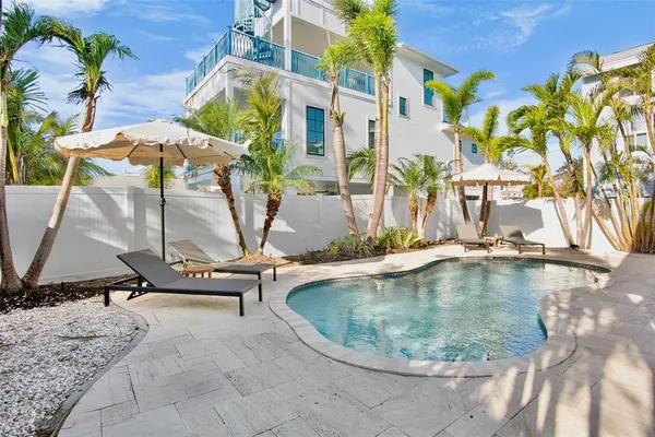 a view of swimming pool with outdoor seating