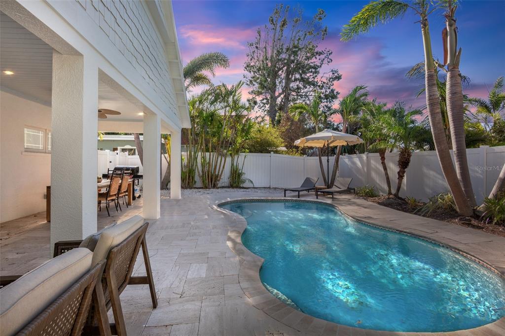 709 Fern Street Anna Maria, FL 34216 - Photo 10 of 35 a view of a backyard with plants and outdoor seating