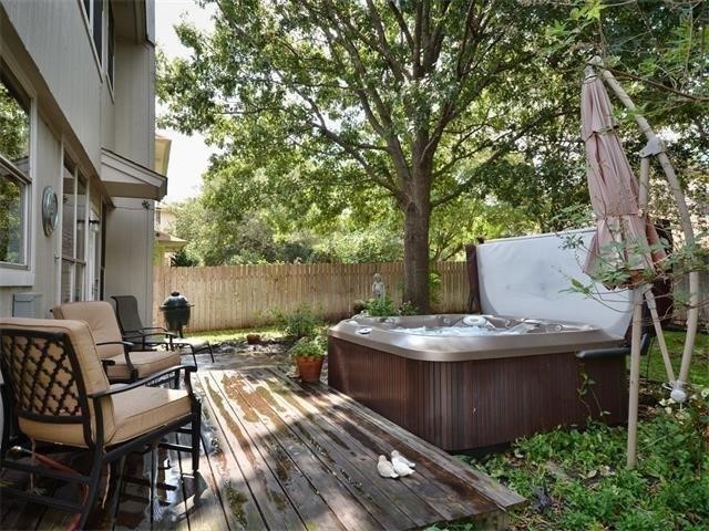 7508 Windrush Drive Austin, TX 78729 - Photo 9 of 22 a view of outdoor sitting area with furniture and wooden floor