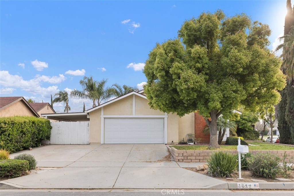 3332 Racine Drive Riverside, CA 92503 - Photo 1 of 1 a front view of a house with a yard and garage