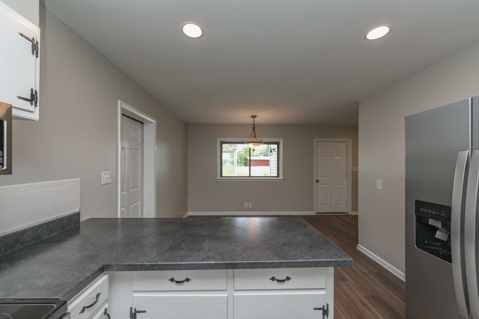 4334 Mt Zion Road Springfield, TN 37172 - Photo 18 of 52 a kitchen with stainless steel appliances granite countertop a sink a stove and a refrigerator